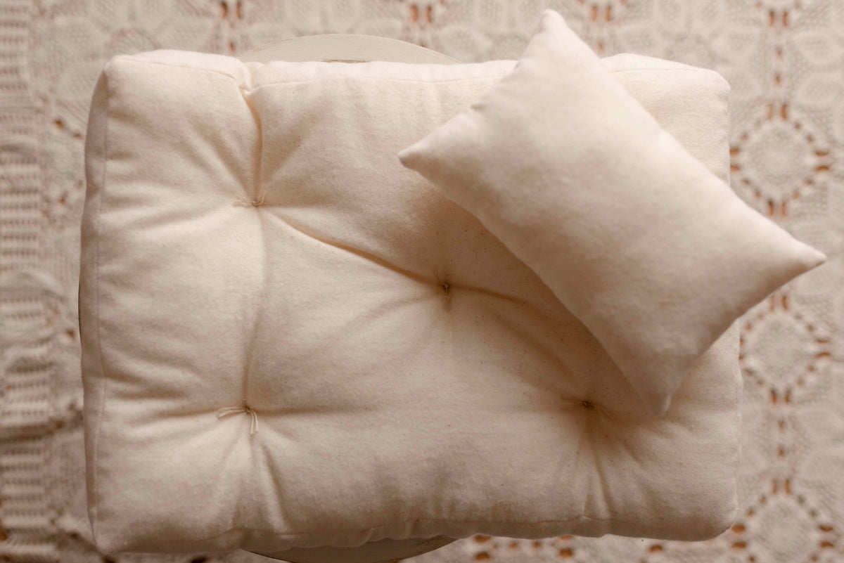 Cream mattress and pillow by Olive & Lace