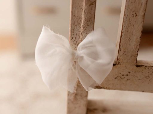 White bow on a non-slip clip by Olive & Lace