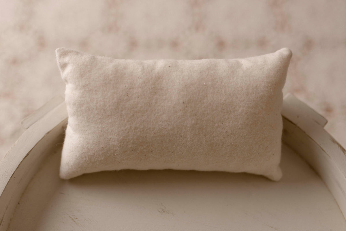 Cream mattress and pillow by Olive & Lace