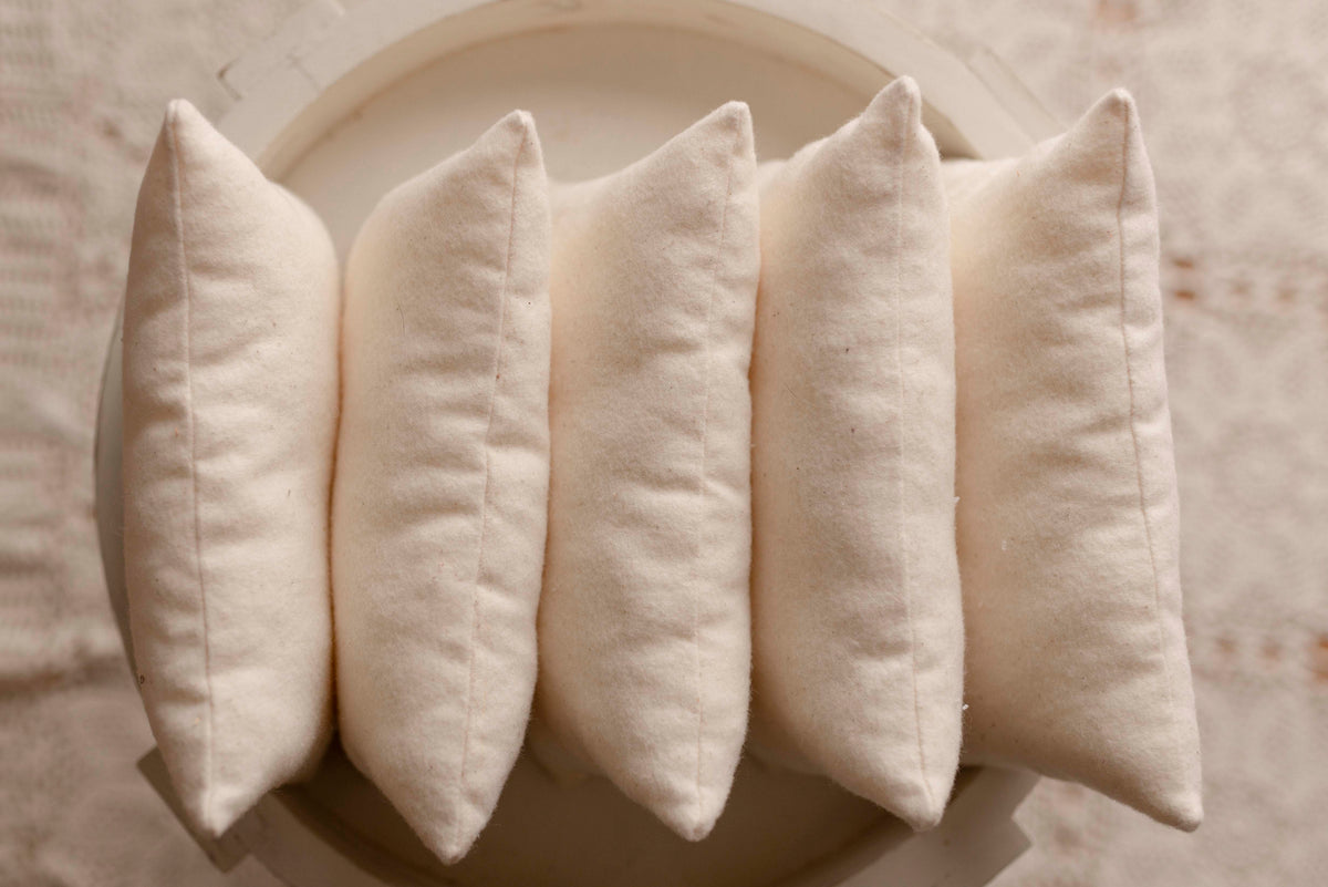 Cream mattress and pillow by Olive & Lace